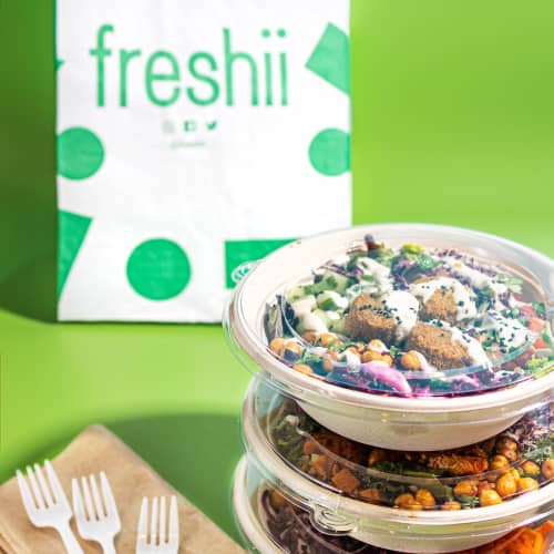 Takeout food from Freshii with a Freshii takeout bag
